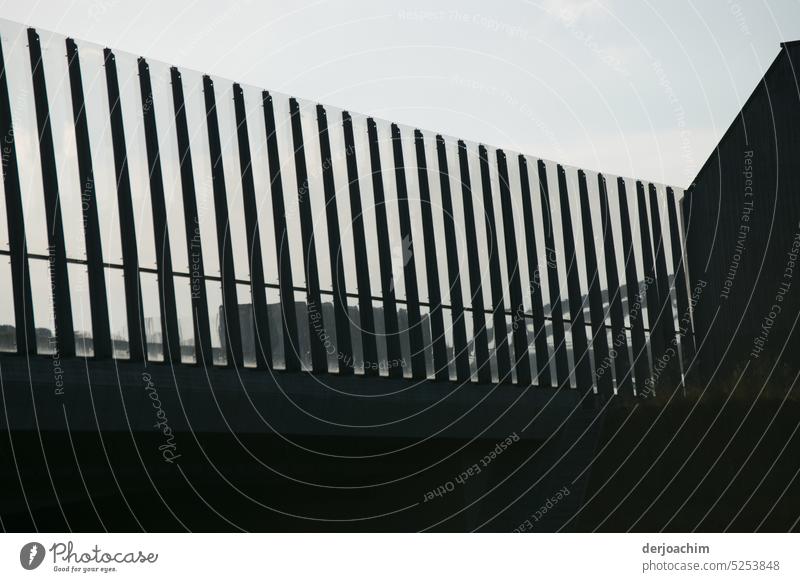Modern noise barrier on the highway. Protective wall Glass Safety Exterior shot Protection Day Window Deserted Bridge Facade Architecture Metal Reflection
