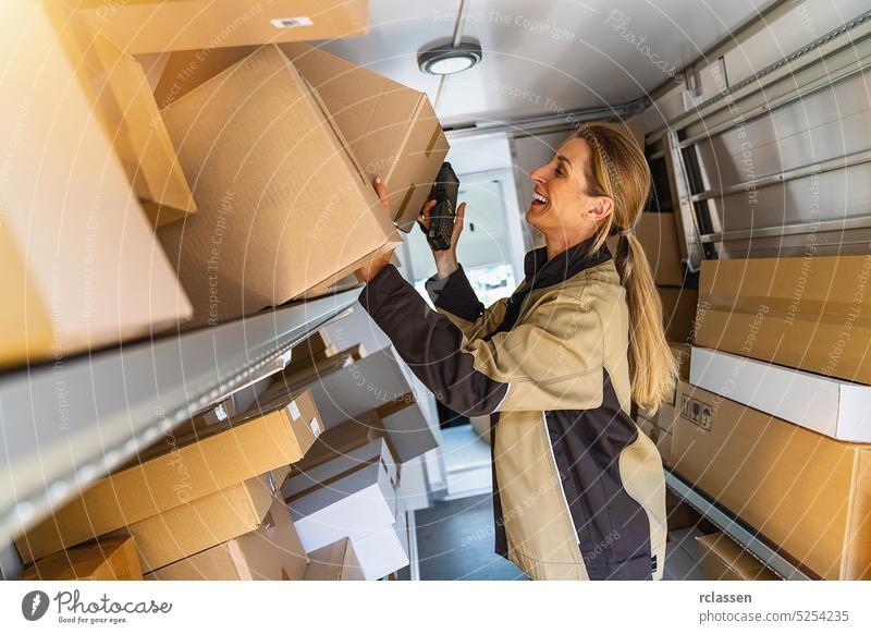 female delivery agent searching in her van parcels to deliver it to a customer grab barcode scanner holding deliveryman smiling happy service order mail storage