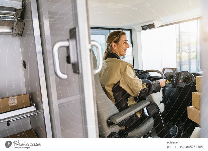delivery woman driving van with packages on the front seat. Happy female courier in truck. Portrait of confident female express courier driving his delivery van.