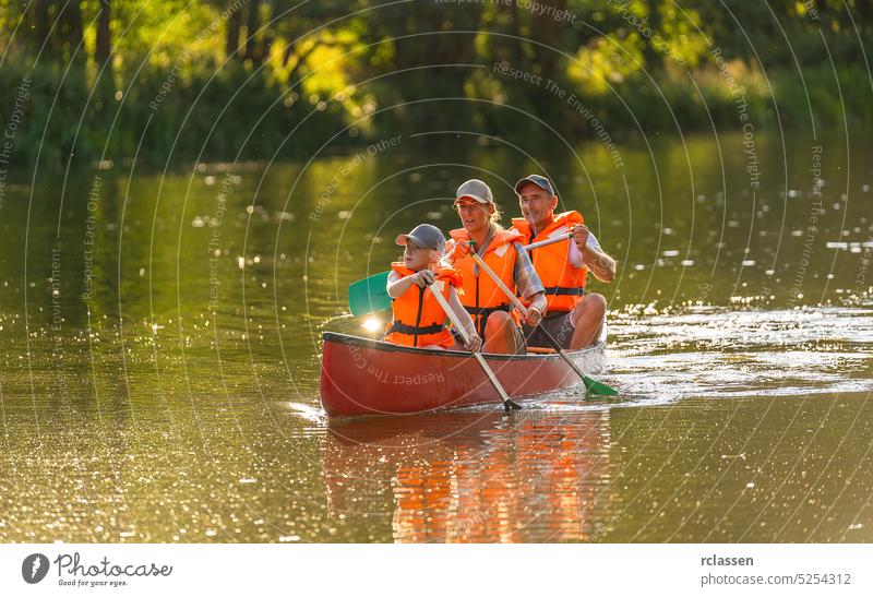Family Canoeing on a river in bavaria germany kayak people summer outdoor canoe beautiful person sun vacation nature boat exploring sport travel lifestyle