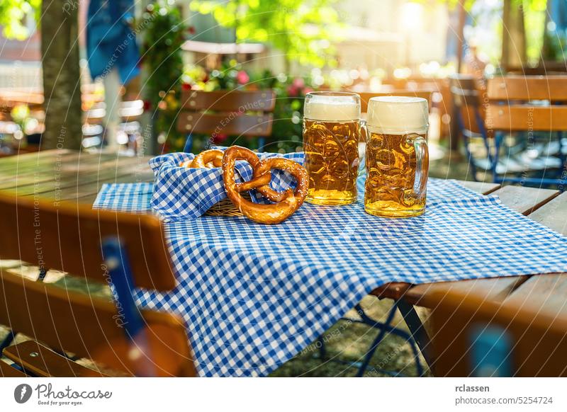 Beer mugs with fresh pretzels or brezen at Oktoberfest, Munich, Germany beer bavarian festival tap background german flag lederhosen munich alcohol bar
