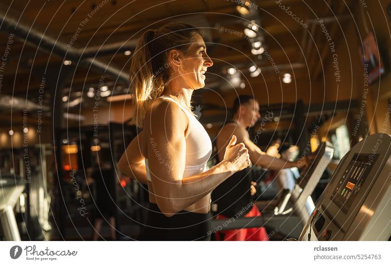 people running on a treadmill in health club man lifestyle machine sportswear athletic woman fitness gym training exercise person fun young beautiful workout