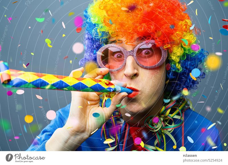 happy party woman with wig and confetti pieces and confetti Falling in colorful colors germany cologne carnival disco parade adult beautiful beauty