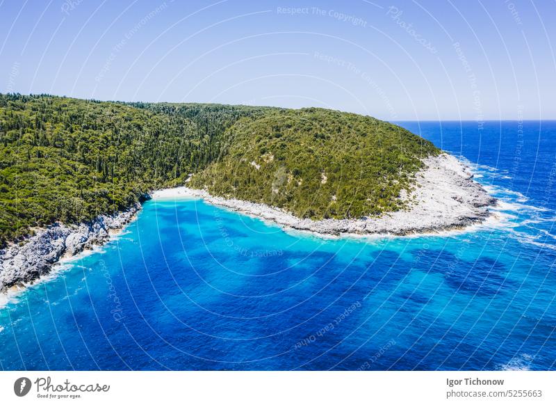 Aerial view of remote Dafnoudi beach in Kefalonia, Greece. Secluded bay with pure crystal clean turquoise sea water surrounded by cypress trees greece aerial