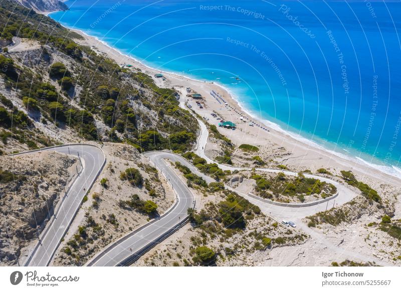Serpentine road to Gialos Beach, Ionian Islands, Lefkada, Greece, aerial view beach greece lefkada ionian gialos outdoor panoramic paradise seascape shore