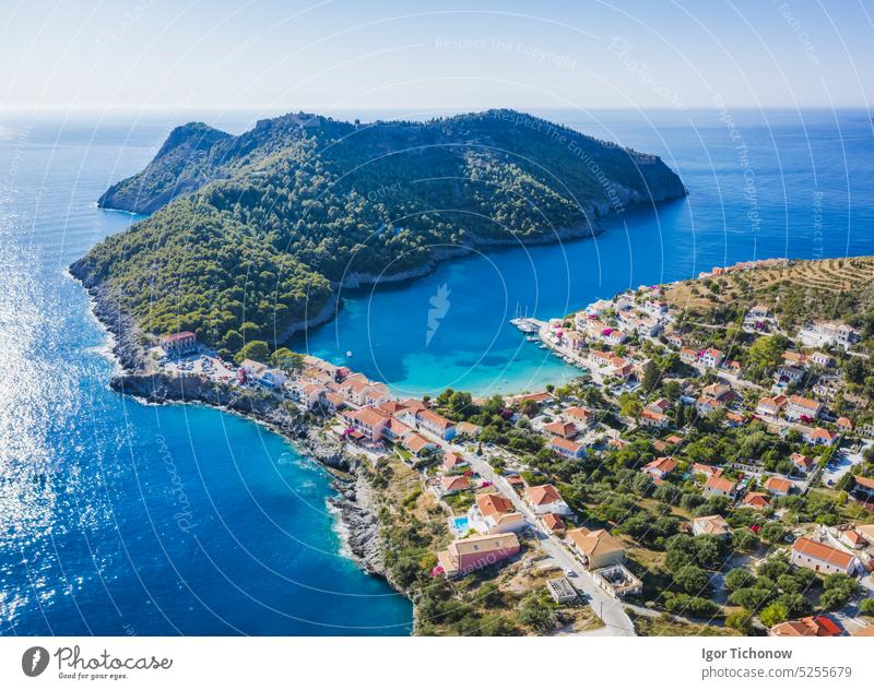Assos picturesque fishing village from above, Kefalonia, Greece. Aerial drone view. Sailing boats moored in turquoise bay greece kefalonia aerial assos sailing