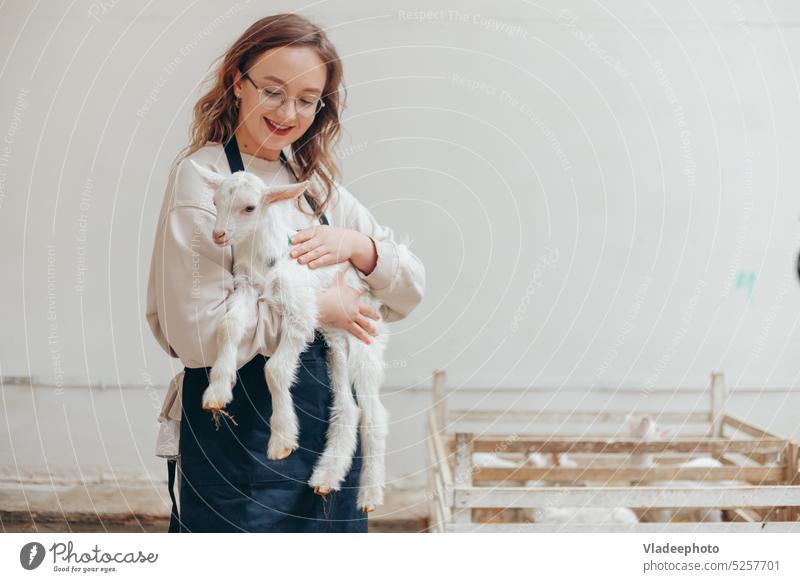Farmer woman with goat on organic farm for dairy products person Woman Participation Child Rural Animal Cute Girl Mammal Love care raise pets Smiling Happy