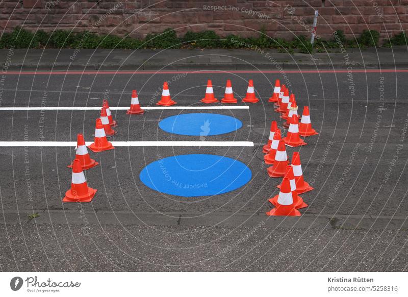 blue circles surrounded by traffic cones marking works Cycle path cycle path Lane markings Traffic lane Pylons guiding cone Traffic cone muster paint on