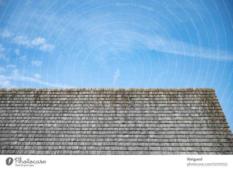 Perspective towards bright blue sky with old wooden roof in foreground Sky Blue sky Upward Transience steadfastness stability House (Residential Structure)