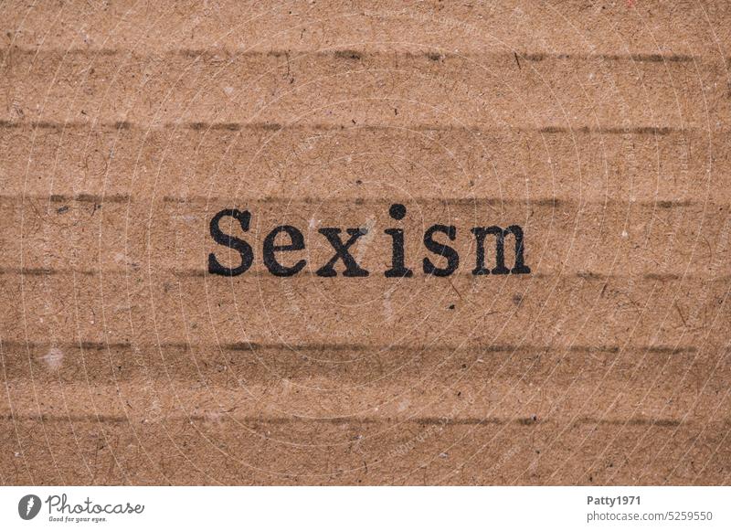 Sexism, Stamped text on cardboard. misogyny Word paperboard discrimination Woman Grunge Cardboard stamped devaluation Hatred Society Text