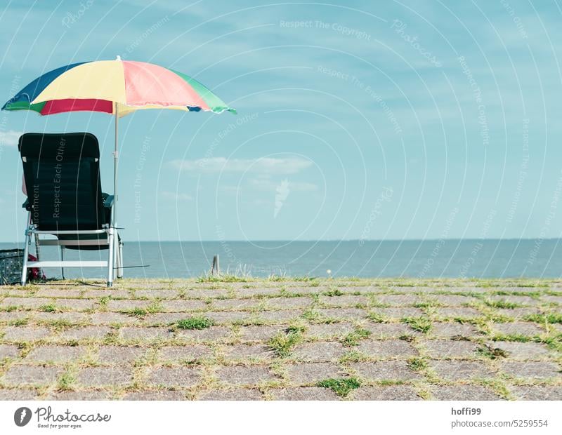 solitary folding chair with parasol and sea view Chair Minimalistic minimalism Deserted Seating Folding chair Camping chair Camping site Isolated Image parasols