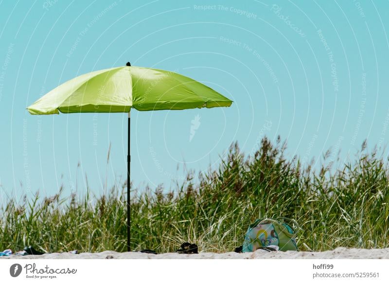 Green parasol in the dunes Sunshade Cloudless sky Blue sky minimalism Sunbathing coast Relaxation Shadow rest tranquil setting Sunlight Calm Sand Island Sky