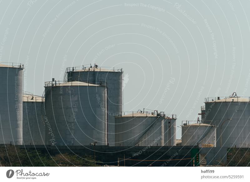 Oil tanks in the harbor in nice weather Gas tank Fuel Gasometer Storage Tank steel wall Shadow play Harbour Energy Industrial plant Supply