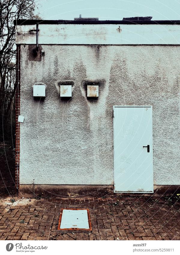 ' ' ' I door Window Weathered transformer station Backup Exterior shot Building Facade Architecture Wall (barrier) Gloomy Deserted Manmade structures Town