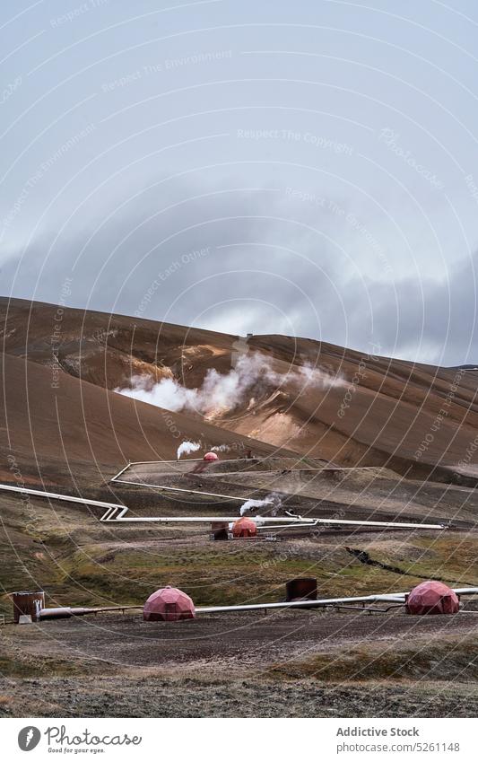 Krafla geothermal power plant on hill landscape nature steam environment slope energy valley geyser picturesque terrain countryside scenery water grass iceland