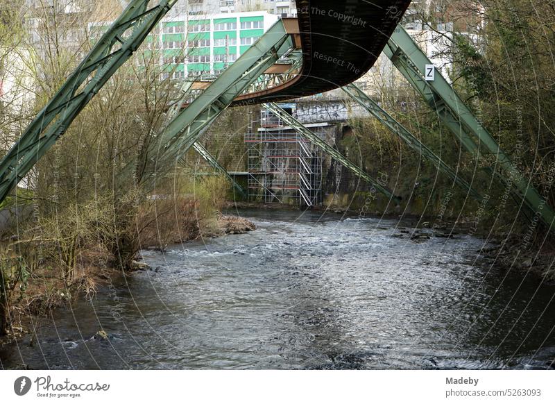 Steel girders of the track of the Wuppertal suspension railroad Over the Wupper river in springtime in the city center of Wuppertal in the Bergisches Land region of North Rhine-Westphalia, Germany