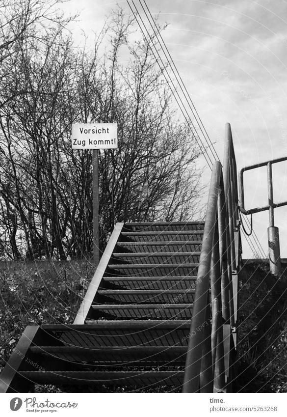 helpful | for everyone with music on their ears Stairs Clue peril railway embankment trees Metal steps Transmission lines Electricity Text Reading Protection