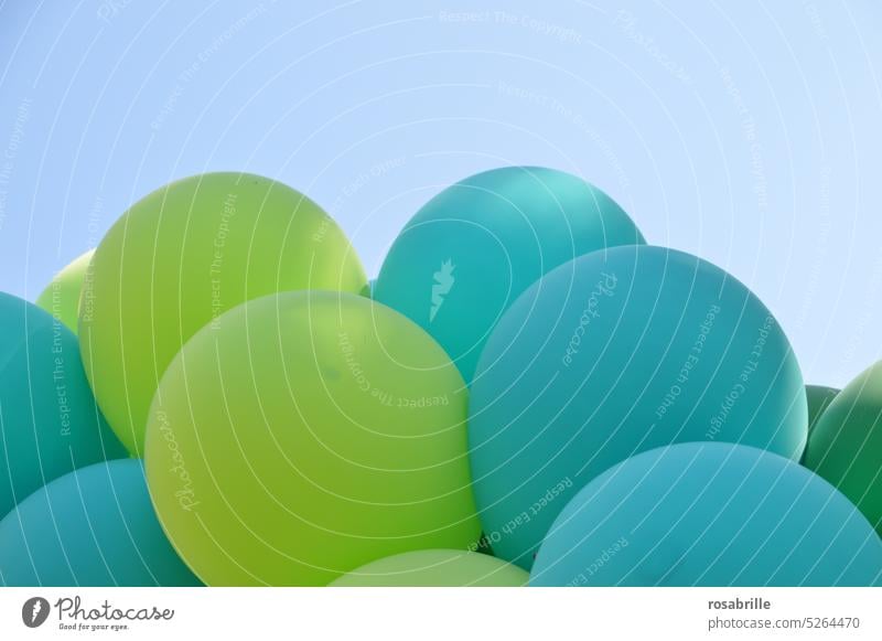 Balloons in green, blue and turquoise against a bright blue sky balloons fun Joy Feasts & Celebrations Decoration Party Birthday Event Happiness Helium