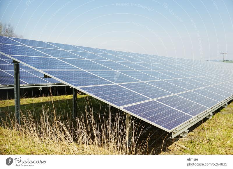 Photovoltaic system on a meadow / green electricity photovoltaics photovoltaic system Solar cells Solar Power light energy alternative power generation Sunlight