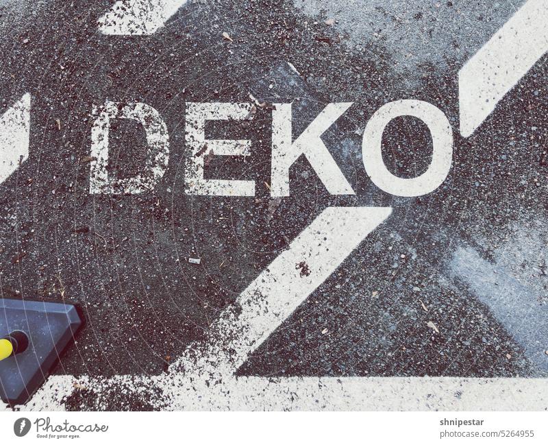 Top view of street sign with the word Deko street lettering Lettering Decoration Road marking Clue Information decoration trash Trashy street art Design lines