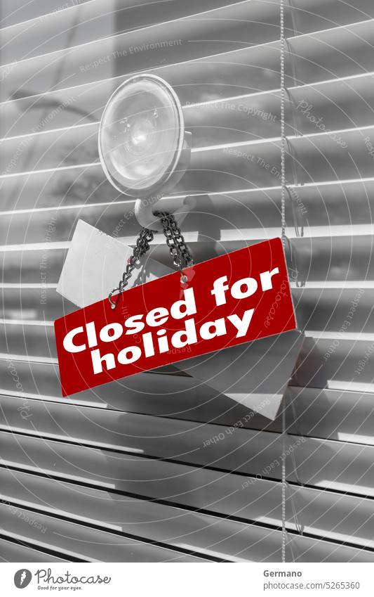 Sign saying "Closed for holiday" on a glass door absent background backgrounds business close closed concept concepts entrance grunge hanging market message