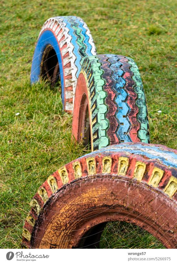 departed | second life as play equipment topic day Tire Car tire Wacky discarded conversion upcycling game device colourful colourfulness Rubber Recycling