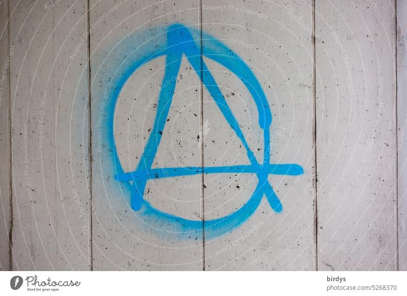 Anarchy, blue symbol on a concrete wall anarchic Graffiti Concrete wall Gray Blue Dominionless Sign symbolism