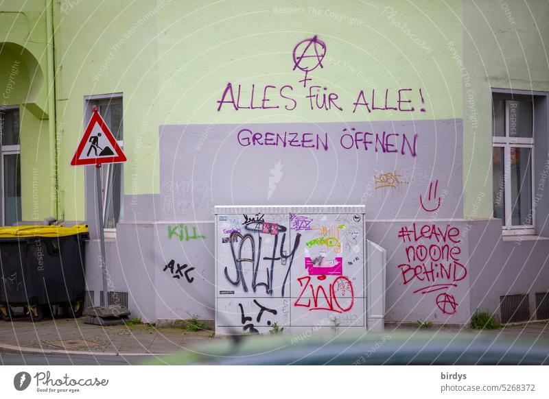 Street corner with leftist and anarchic protest graffiti Graffiti Anarchy anti-capitalism Refugee Human rights Symbols and metaphors idealism Freedom