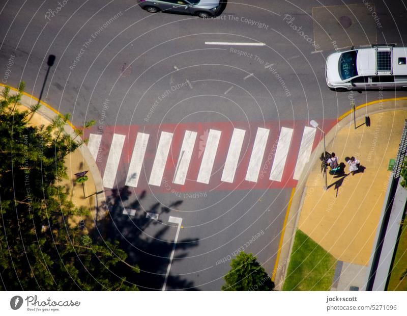 Pedestrians walk on the right and cars drive on the left at the crosswalk Pedestrian crossing Street Lanes & trails Traffic infrastructure Zebra crossing