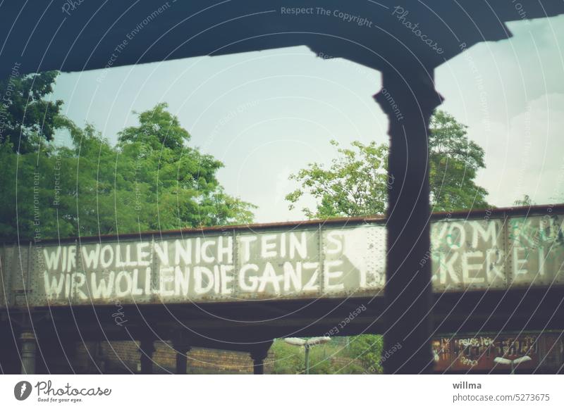 We don't want a piece of the cake, we want the whole bakery. Graffiti on a steel bridge in Berlin. Bridge Steel bridge protest rebel