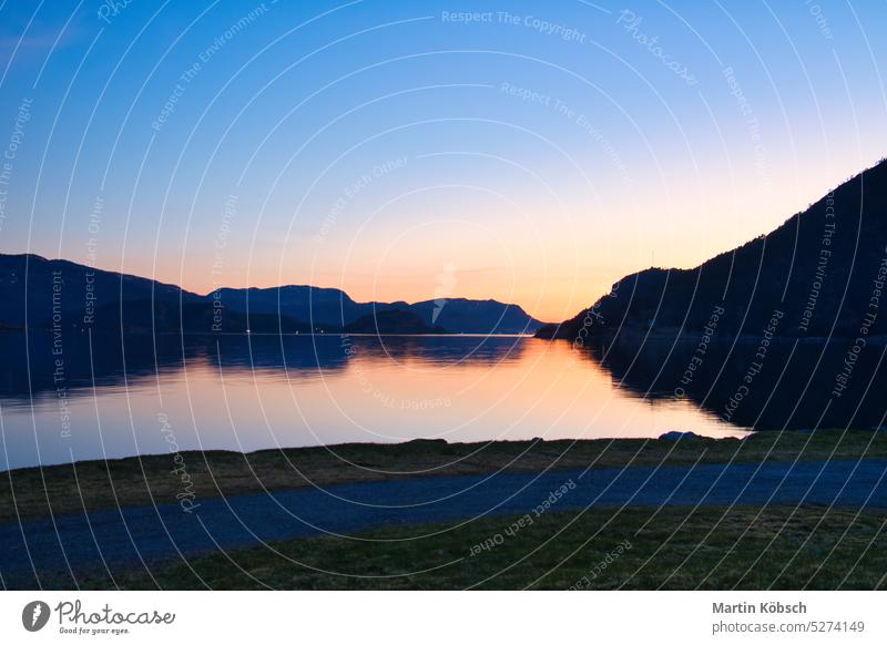 Fjord with view of mountains and fjord landscape in Norway. Landscape shot sunset water nature recreation fresh relax wilderness emotion relaxation life
