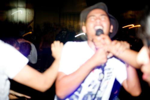 blurred of asian young man enjoying and sing along at hardcore/punk gigs show audience band cheering concert concert stage crowd dancing entertainment event