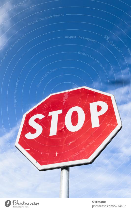 Stop sign against blue sky Europe Obedience angle background below bottom clouds cloudscape cloudy communication danger european information message metal