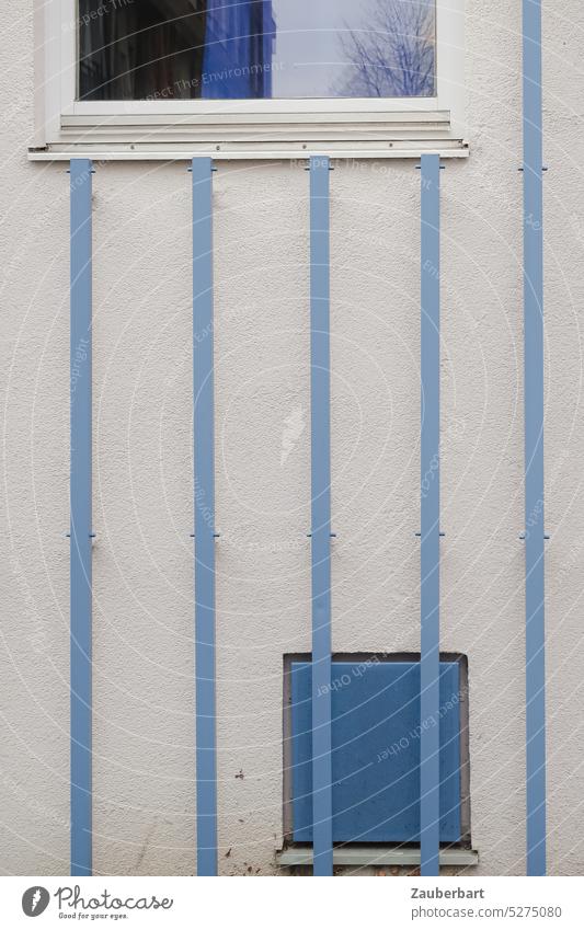 Blue grid forms vertical lines on facade with blue details and windows Vertical Grating Facade Window Abstract Pattern light blue House (Residential Structure)