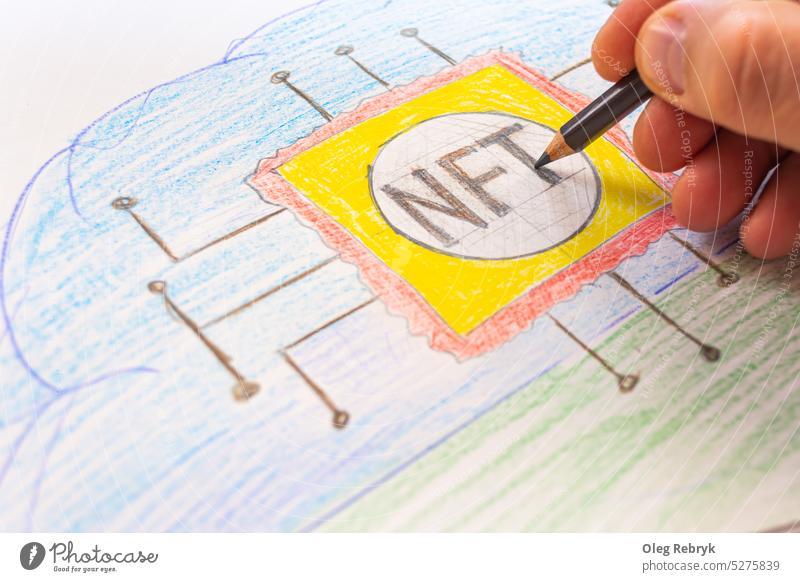 Man's hand draws with colored pencil visual technology concept of selling unique collectibles. Crypto art concept. NFT Non fungible token. digital nft