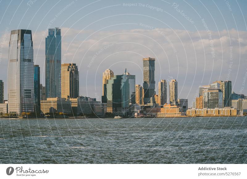 Cityscape with skyscrapers and blue water city building sea cityscape downtown district megapolis skyline megalopolis blue sky modern urban united states