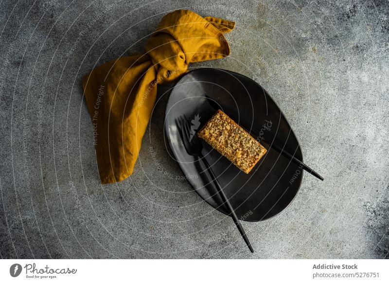 Caramel cake served on the plate bake caramel dessert eat eating food meal napkin piece sweet table tasty textile homemade baked appetizing decorate delicious