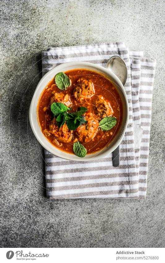 Stewed meatballs in tomato sauce bowl cooked diet dinner dish food gourmet healthy herb homemade keto ketogenic meal mint served spiced spicy stew spoon stewed