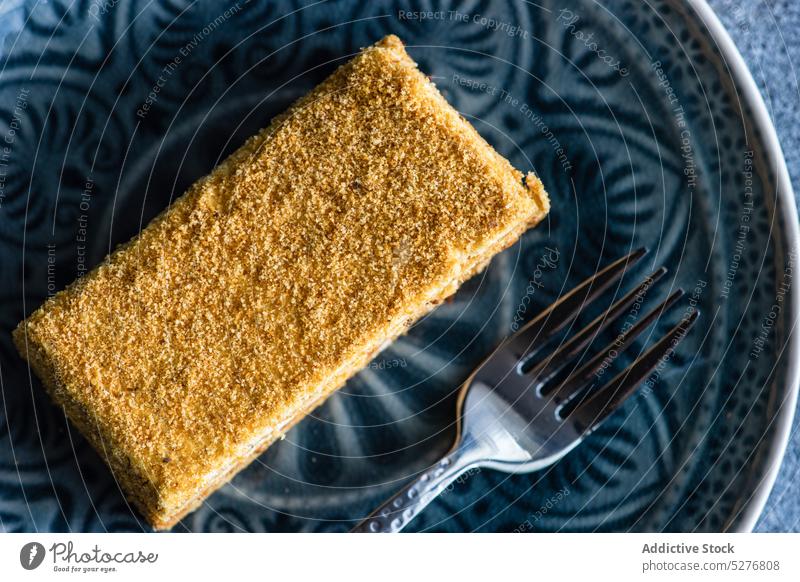 Honey cake on the plate honey bake biscuit ceramic plate cream dessert eat food fork gourmet meal sugar pastry served slice sweet table tasty topping unhealthy