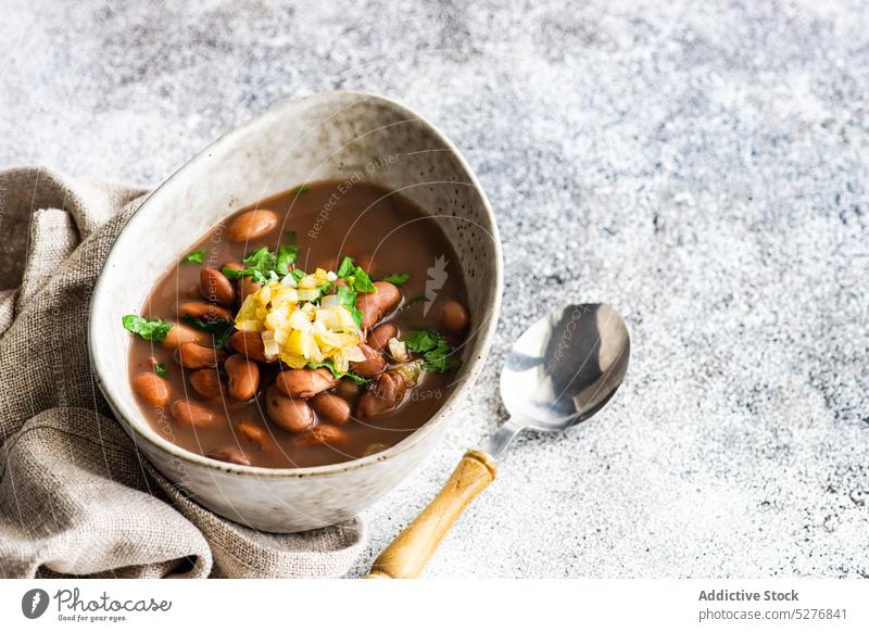 Bean vegetable soup served in the bowl background bean concrete coriander cuisine dinner bowl dish eat eating first dish food garlic gourmet herb lobio meal