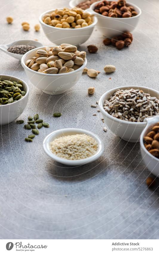 Bowls full of nuts and seeds almond bowl ceramic snack flax food frame hazelnut keto meal assortment diet organic pistachio chia nutrition protein healthy