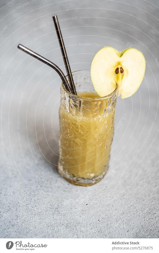 Apple smoothie served in glass with sliced apple beverage cider concrete detox diet drink drinking food fresh freshness fruit glassware gourmet green half