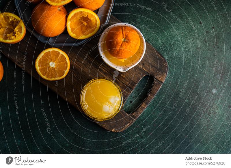 Fresh orange juice and ripe fruits beverage citrus concrete cutting board diet drink natural vitamin c fresh glass tropical raw gourmet refreshment green group