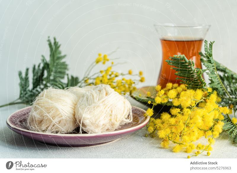 Turkish delight and tea drink dessert Acacia dealbata Easter aroma aromatic background beverage blue wattle concrete eat eating flora floral flower food