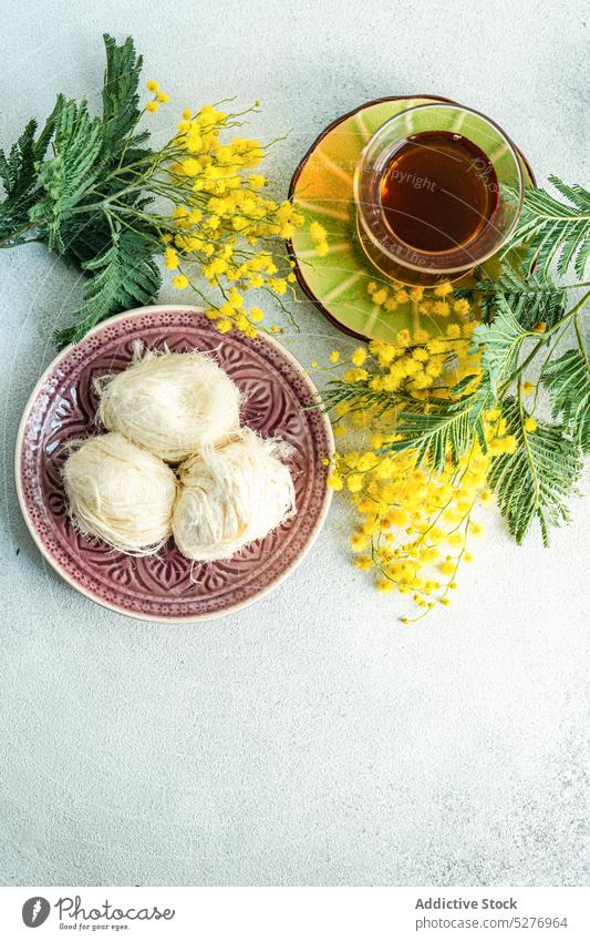 Turkish delight and tea drink dessert Acacia dealbata Easter aroma aromatic background beverage blue wattle concrete eat eating flora floral flower food