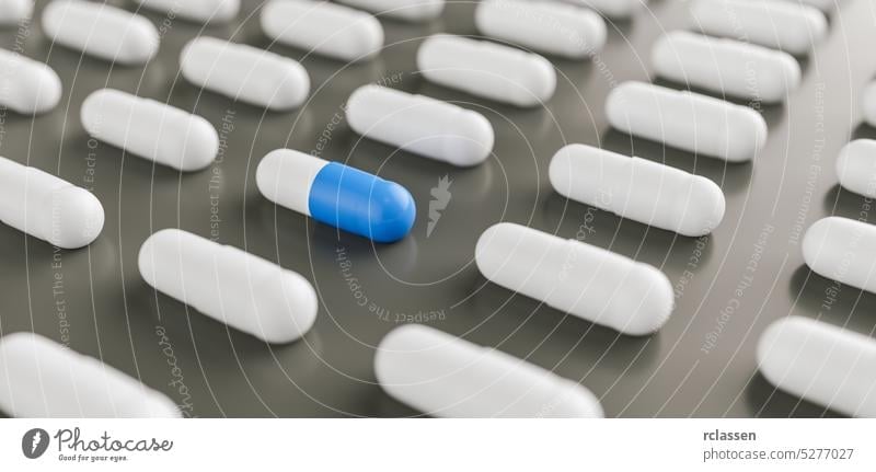 blue and white pills or capsules lies in rows, medicine tablets antibiotic, Pharmacy theme capsule background pharmacist pain medical prescription aspirin cure