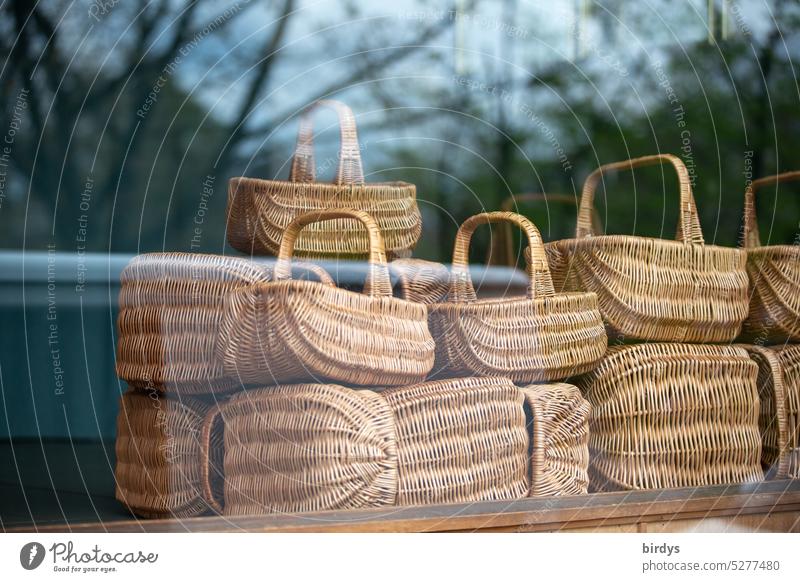 woven baskets as a display in a shop window Shopping basket Wicker baskets Natural product Sustainability Basket weaver Display Shop window Handle basket