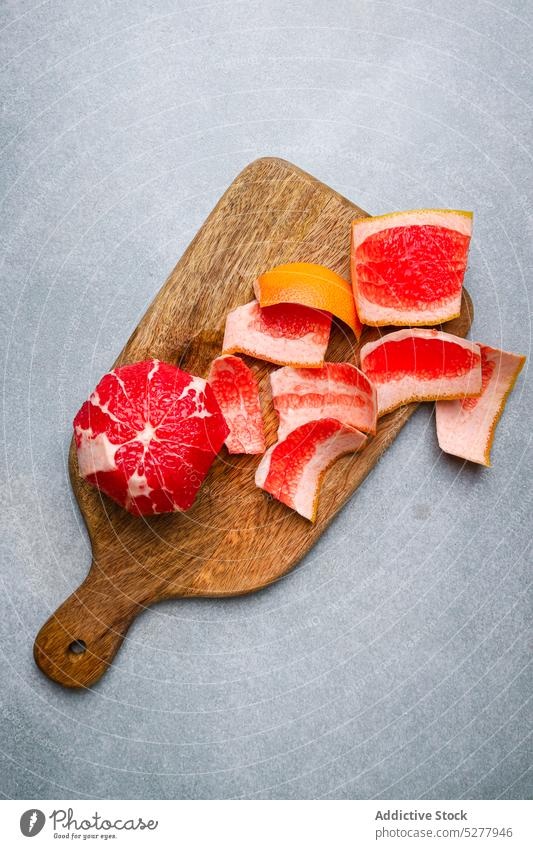 Peeled red orange on wooden board peel fruit cutting board food ripe fresh organic delicious ingredient yummy tasty natural citrus prepare bright vitamin
