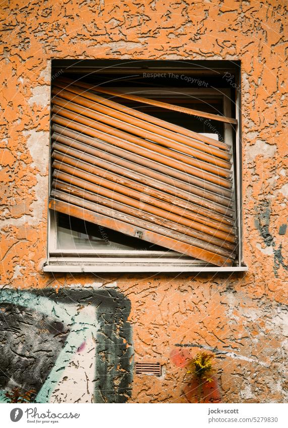sloping and oblique roller shutter Roller shutter Window Broken Wall (building) obliquely Old Graffiti Street art Weathered Closed Unhooked Authentic Transience