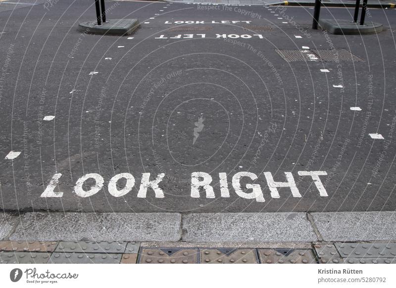 look right lettering on the english street Look right Right peep Street Crosswalk Traffic lane Clue Text writing Ground England London Left-hand traffic